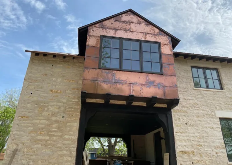 Copper metal panel facade on a stone building for Metal Roof Coating in Cocoa West